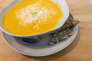 Pumpkin soup with coconut raps and bread