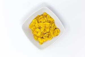 Purely Plantain banana chips in a square bowl on white background - top view