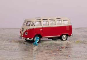 Pushpin with vintage camper van on map