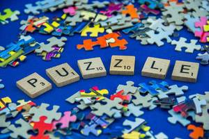 Puzzle Word Surrounded by Pieces