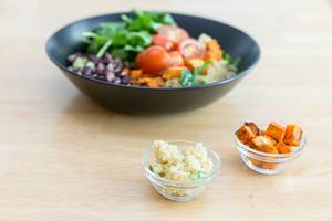 Quinoa and roasted sweet potatoes in tiny glass bowls
