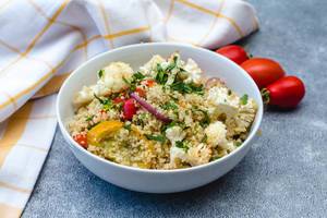 Quinoa with Roasted Vegetables in a White Bowl