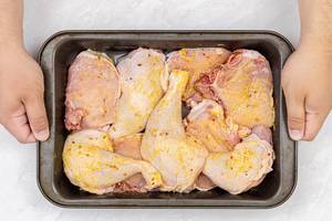 Raw Chicken and Pork meat in the baking tray