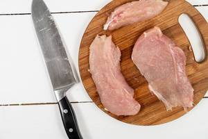 Raw Chicken Breasts on the cutting board
