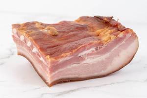 Raw-homemade-pork-bacon-on-the-white-marble-board.jpg