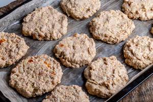 Raw oatmeal cookies on a baking sheet before baking (Flip 2019)