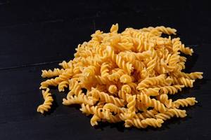 Raw Pasta on the black table