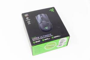 Razer Viper Ultimate wireless gaming mouse with charging dock in the package on white background