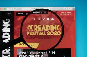 Reading Festival logo on a computer screen with a magnifying glass