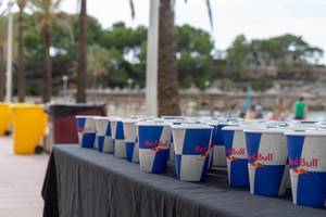 Red Bull paper cups with refreshment for the athlets