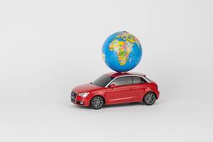 Red car with a world globe