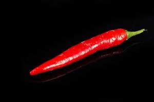 Red Chilli Hot Pepper above black background