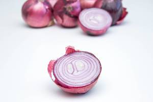 Red Onion close-up on a White Background   Flip 2019