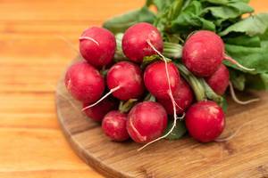 Red Radishes on the wooden board