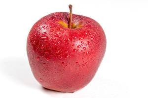 Red ripe apple with drops of water