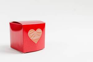 Red square gift box with a heart