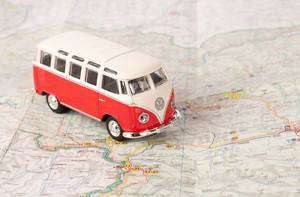 Red vintage camper van on map (Flip 2019)