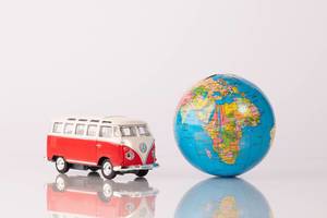 Red vintage camper van with globe (Flip 2019)