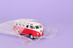 Red VW Bully packed in bubble wrap