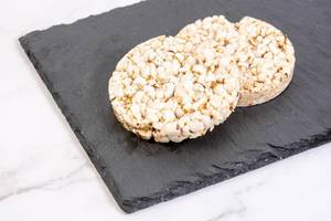 Rice Cakes with Flax and Sunflower on the stone tray