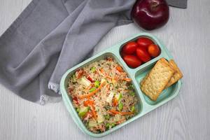 Rice Salad wiht Tomatoe and Cracker in a Bento Box Top View