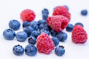 Ripe summer berries of blueberries and raspberries