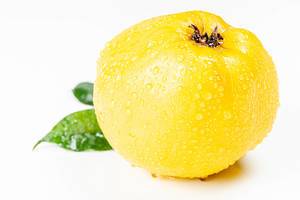 Ripe yellow quince with water drops on a white background (Flip 2020)