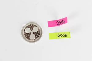 Ripple coin with bad and good post its