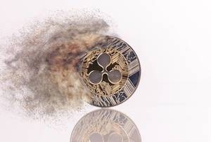 Ripple coin with smoke on white background