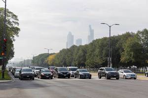 Road traffic in Chicago: cars in six lanes waiting for the green light at an intersection