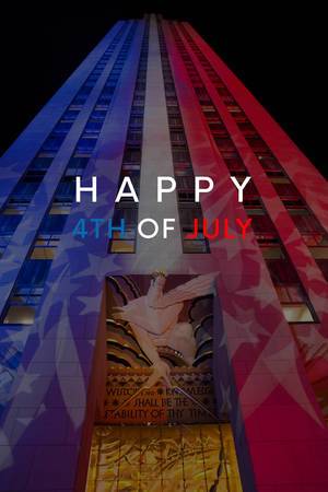 Rockefeller Center in Manhattan, New York, during Election Night, shines in the color of the US flag, with the title Happy 4th of July