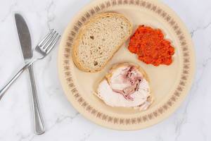 Rolled Chicken meat with homemade ajvar and bread on the plate (Flip 2019) (Flip 2019) (Flip 2019)