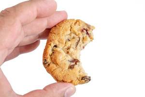 Round Biscuits with Raisins in the hand