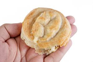 Round Burek Pie with Meat in the hand