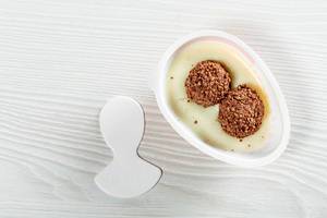 Round waffle balls with chocolate cream in kinder joy half (Flip 2019)