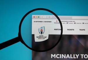 Rugby World Cup logo on a computer screen with a magnifying glass