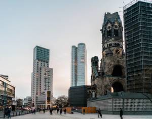 Ruined church of Kaiser Wilhelm next to high-rise buildings in downtown Berlin (Flip 2019)