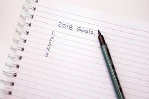 Ruled notebook with empty list of goals for 2018