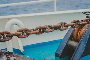 Rusty and mossy ship chain
