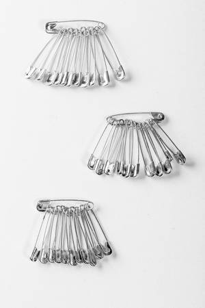 Safety pins, which pinned to the fabric