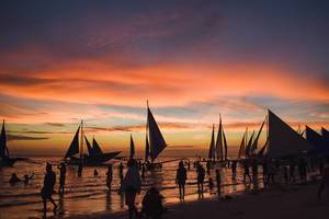 Sailboats docked during golden hour at Boracay