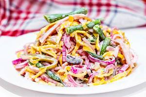 Salad with asparagus, sliced ham and scrambled eggs, pickled purple onion and cucumbers and sauce (Flip 2019)