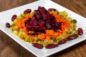 Salad with boiled beets, carrots, beans and pickles closeup (Flip 2019)