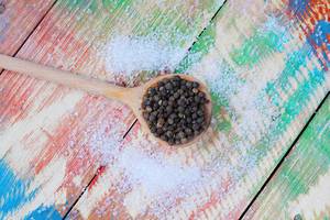 Salt Pepper in Wooden Spoon, Colored Vintage Background (Flip 2019)