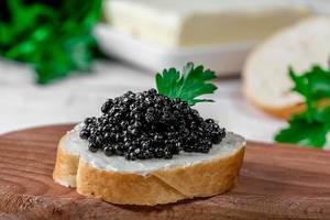 Sandwich with butter and caviar close-up