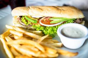 Sandwich with french fries and dressing