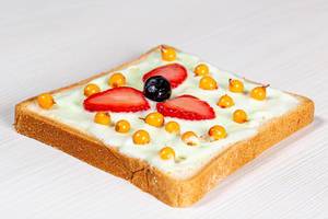 Sandwich with sea buckthorn berries, blueberries and strawberries