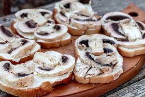 Sandwiches with mushrooms on the kitchen wooden Board (Flip 2019)