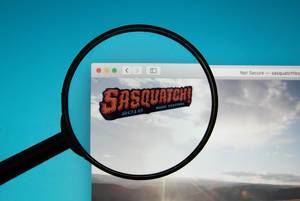 Sasquatch! Music Festival logo on a computer screen with a magnifying glass