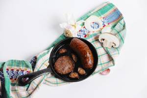 Sausages and salami in a pan